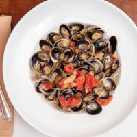 Capellini Vongole · Baby Clams simmered with garlic, olive oil, white wine,  fresh Tomato and clam broth flavore...
