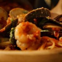 Seafood Combo Dinner · Shrimp, calamari, mussels and clams in a marinara sauce over linguine. Served with homemade ...