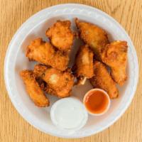 Buffalo Style Wings · Served with hot sauce and blue cheese.