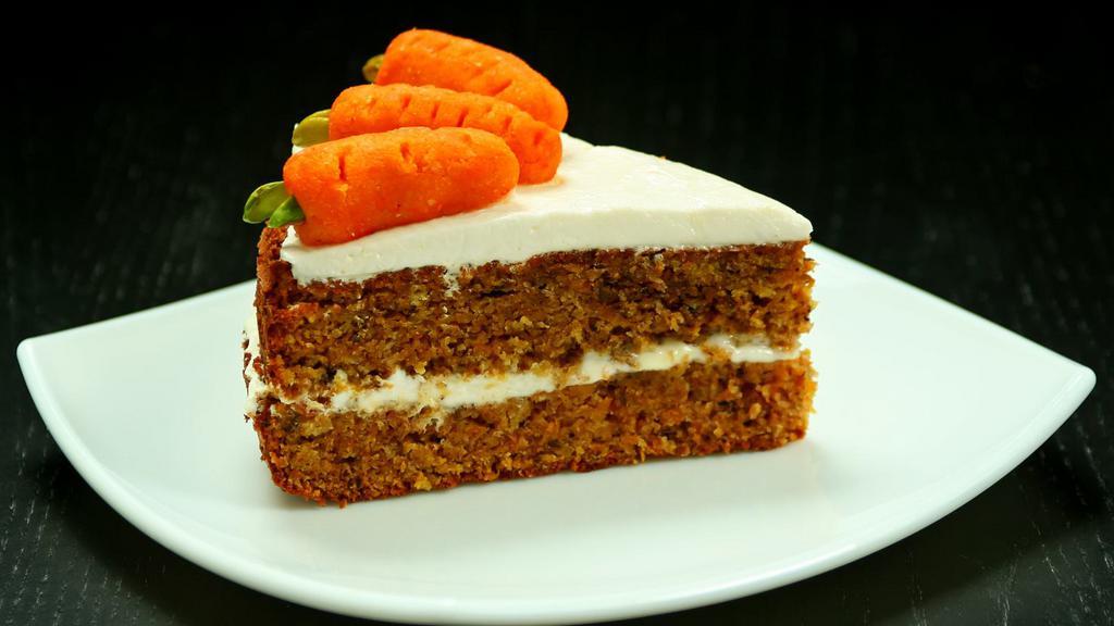 Carrot Cake · Perfectly spiced, moist carrot cake with a a thick, rich cream cheese frosting.