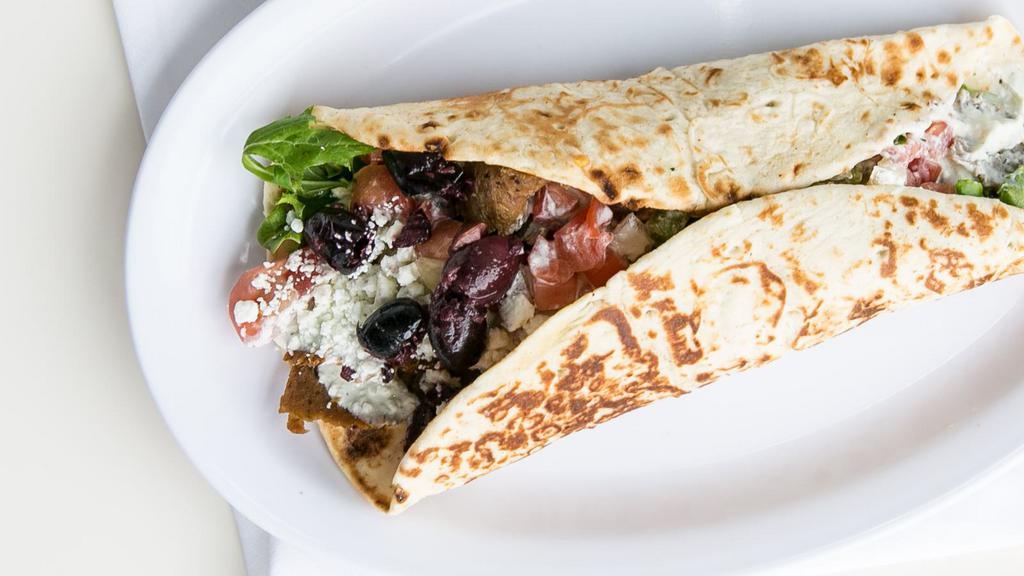 The Gyro Wrap · Housemade yeero gyro, Greek salad, tzatziki.