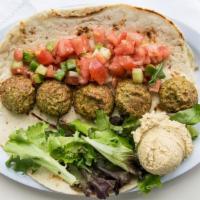 The Veggie Wrap · Vegetarian. Falafel, Greek salad, organic greens and hummus.