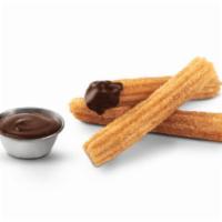 Churros · Churros are dusted in cinnamon sugar, served with a choice of dip-cups.