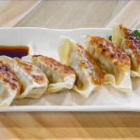 Dumplings · With a choice of miso soup, salad, or rice. Choice of original pork, shrimp, seafood, or veg...