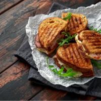 Chipotle Turkey Panini · Grilled Panini Sandwich made with European Flatbread and topped with Turkey, pepper jack che...