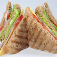 Chicken Club Panini  · Grilled chicken, smoked bacon, brie cheese, plum tomatoes and our house Caesar dressing. Gri...