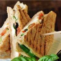 Veggie Panini · Grilled Panini Sandwich made with European Flatbread and topped with Fresh mozzarella, fresh...