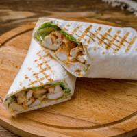 Chicken Caesar Wrap · Delicious Wrap made with Grilled chicken strips, romaine lettuce, and Caesar dressing.