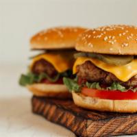 Cheeseburger · Mouthwatering 1⁄4 lb beef-burger made with fresh lettuce, tasty onions, tomatoes, ketchup, m...