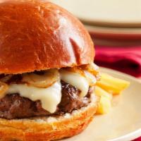Truffle-Upagus Burger · Incredible Wagyu beef burger infused with black truffles! Garnished with roasted garlic mayo...
