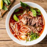 Spicy Beef Pho Noodle Soup / 辣熟牛肉河粉 · Cooked beef with rice noodles, served with spiced beef broth, onions, scallions, and lemon, ...