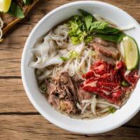 House Pho Noodle Soup / 经典火车头 · Comes with rare eye round, brisket, tripe and tendon, with rice noodles, served with beef br...