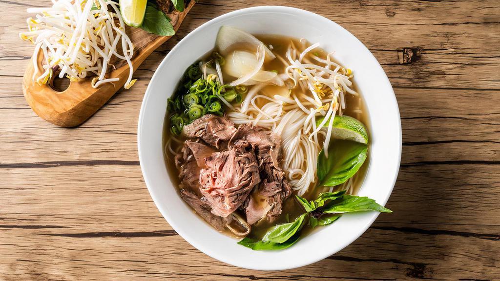 Cooked Beef Pho Noodle Soup / 熟牛肉越南河粉 · Cooked beef with rice noodles, served with beef broth, onions, scallions, and lemon, basil & bean sprouts on the side.