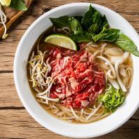 Classic Rare Beef Pho Noodle Soup / 生牛肉越南河粉 · Rare beef  with rice noodles, served with beef broth, onions, scallions, and lemon, basil & ...