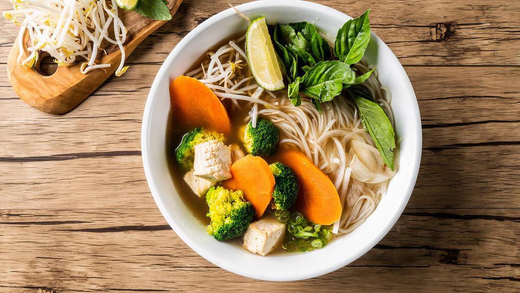 Vegetarian Pho Noodle Soup · Mixed vegetables, with rice noodles, served with vegetarian broth soup, onions, scallions, and lemon, basil & bean sprouts on the side.