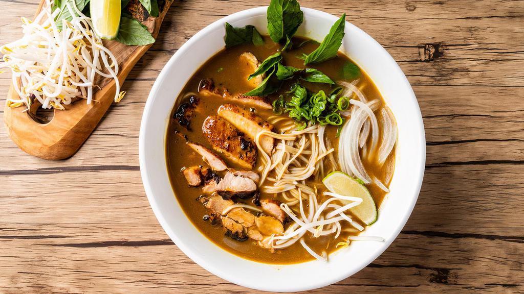 Curry Chicken Pho Noodle Soup · Grill chicken with rice noodles, served with curry flavor broth, onions, scallions, and lemon, basil & bean sprouts on the side.