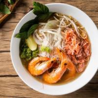 Shrimp Pho Noodle Soup · Jumbo shrimps with rice noodles, served with chicken broth soup, onions, scallions, and lemo...