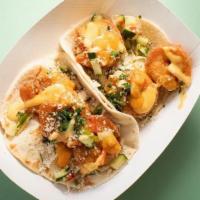 Shrimp Tacos · two tacos/pico/pineapple salsa/cotija cheeese/ pom pom sauce/avo