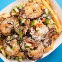 Loaded Shrimp And Queso Fries · juicy saltado style fries stir-fried w/ onions, peppers, cilantro