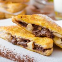 The Nutella French Toasts · Fluffy French toasts topped nutella, syrup and butter.