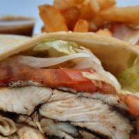 Jerk Chicken Wrap & Fries · A grilled tortilla loaded with sliced Jerk chicken breast, fresh lettuce, tomatoes, and our ...