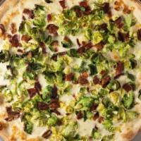 Baby Brussels Sprouts & Bacon · Topped with crushed black pepper and truffle oil.