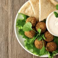 Lamb And Falafel Gyro Platter  · Juicy thin sliced lamb and fritter with mix salad and chef's sauce.