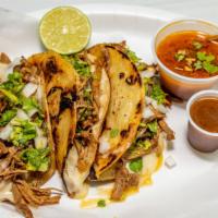 Birria Tacos  · Crispy tortilla with beef & cheese with a side of Birria stew and spicy sauce