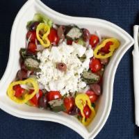 Greek Salad · Over  romaine lettuce, cucumber, feta cheese, red onions, kalamata olives, grape leaves, pep...