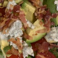Cobb Salad · Avocado, tomatoes, hard-boiled egg, bacon and crumbled blue cheese served over Romaine lettu...