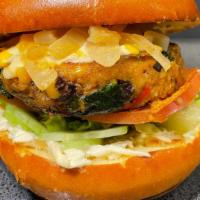 Veggie Burger · All natural vegetarian burger topped with cheddar cheese, lettuce, caramelized onions, tomat...