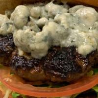 Black N Blue Burger · All natural Angus beef topped with blue cheese, blackened spices, lettuce and tomato on brio...