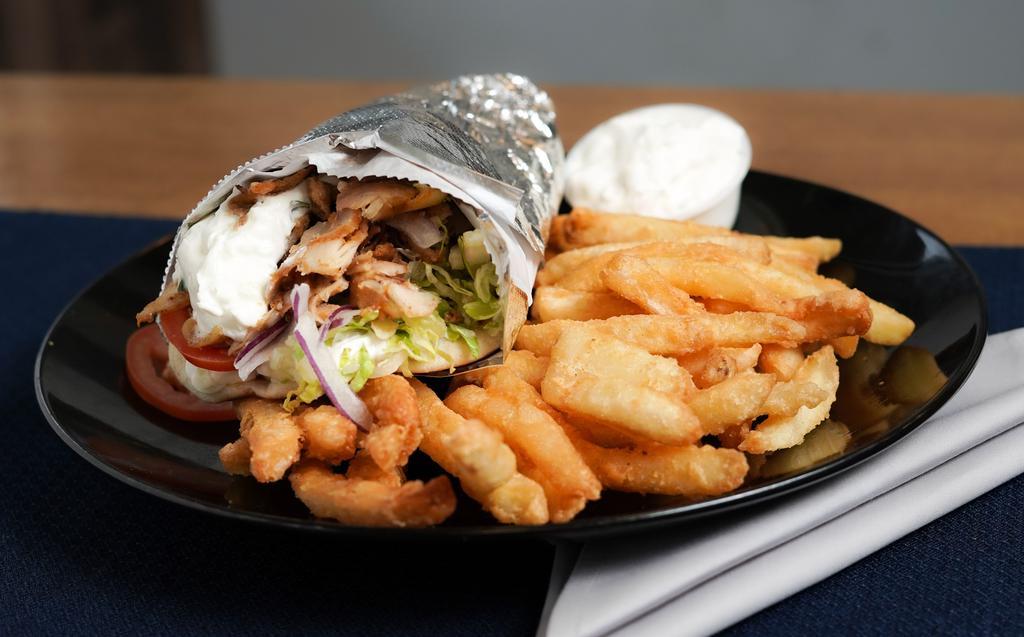 Chicken Gyro (Special) · Authentic chicken gyro wrapped in pita bread with tzatziki, lettuce, tomato, onions, fries and extra tzatziki sauce on the side.
