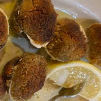 Baked Clams · Whole Baked Clams seasoned with Bread Crumbs, Lemon Juice and Oregano
