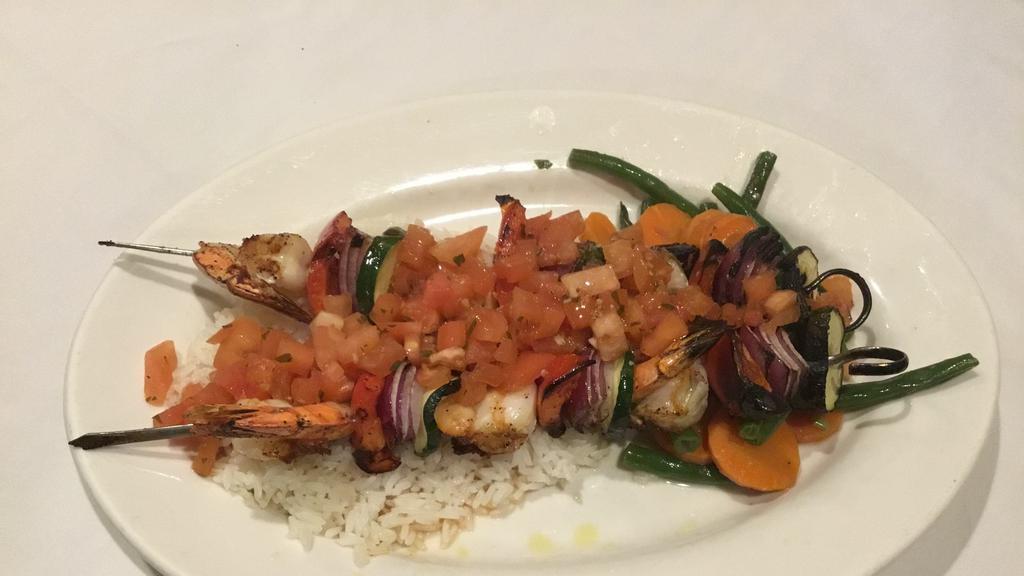 Shrimp Spiedini · Grilled Shrimp, Zucchini, Onions, Peppers, Tomato Vinaigrette over Jasmine Rice