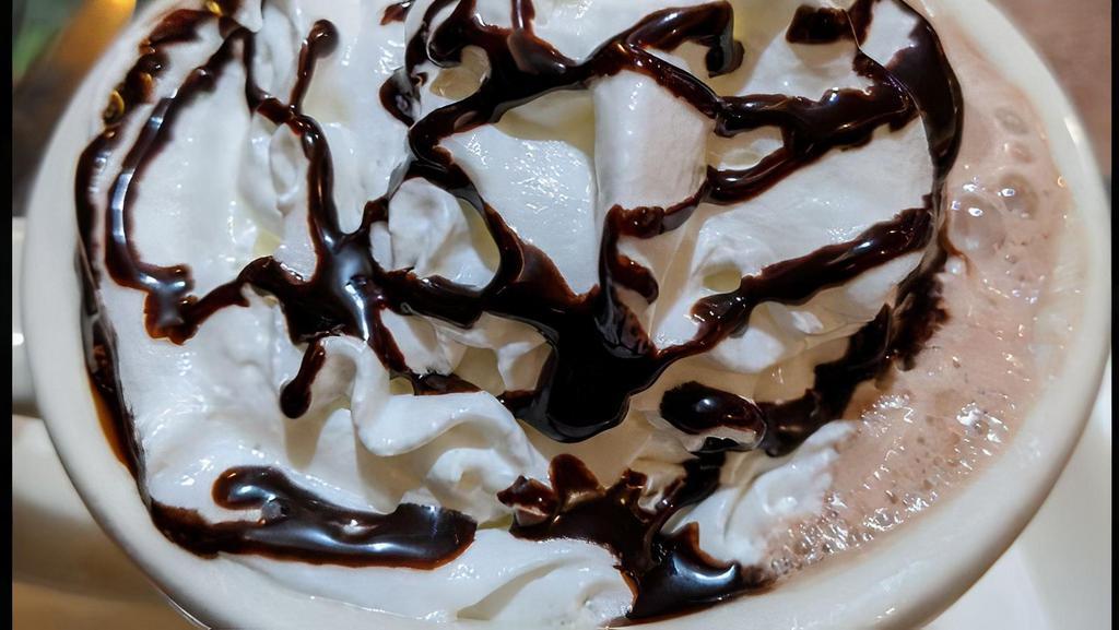 Hot Ghirardelli Chocolate · Ghirardellis chocolate with steamed whole milk and topped with whipped cream, chocolate sauce, and cocoa powder.