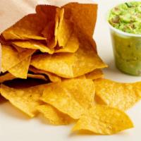Chips Y Guacamole · Our homemade guacamole dip with chips.