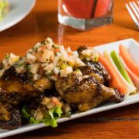 Chicken Wings · Choice of: Memphis dry rub, spicy buffalo, sesame ginger, Jamaican jerk, mango habanero.