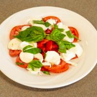 Caprese Salad · Sliced tomato, fresh mozzarella, light oil, and basil