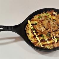 Okonomiyaki · Japanese savory pancake consist of a variety of vegetable, bacon and an egg.