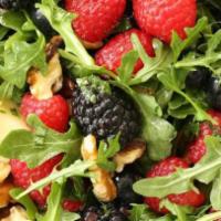 Wandering Strawberry · Organic fresh berries, fried goat cheese, walnuts, baby arugula and strawberry vinaigrette.