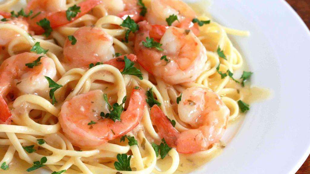 Linguini Shrimp Scampi · Marinated wild gulf shrimps, parsley, thyme, garlic, butter, white wine lemon sauce, 5 months aged Parmesan cheese. Served with fresh bread, choice of optional protein and vegetable add ons.