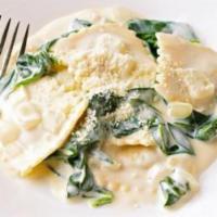 Cheese And Spinach Ravioli · Creamy pesto sauce, baby spinach cheese. Served with fresh bread, choice of optional protein...