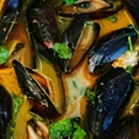 Thai Mussels · Wild organic PEI mussels, ​red Thai curry mild spicy, coconut cream sauce served with ultima...