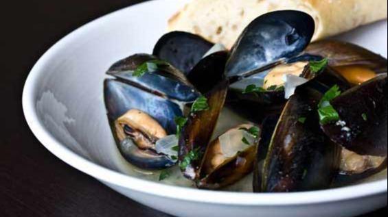 Mussels Mariniere · Wild organic PEI mussels, thyme, parsley, white wine sauce. Served with toast and ultimate crispy fries.