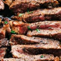 Marinated Grass Fed New York Strip Steak Side · Deliciously marinated with rosemary, garlic and smoked Spanish paprika.