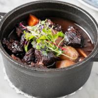 Bœuf Bourguignon · Braised Black Angus beef stew in a red wine aromatic sauce, carrots, steamed potatoes, butto...