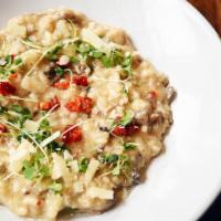 Risotto Aux Champignons · Arborio rice risotto, porcini, oyster and button mushrooms, mascarpone, parmesan. Vegetarian.