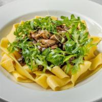 Pappardelle Aux Cêpes · Fresh pappardelle pasta, porcini mushroom, arugula, grated parmesan. Vegetarian.