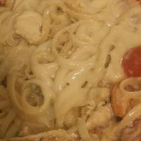 Blackened Chicken Alfredo · Favorite. Spicy. Served over linguine with scallions and chopped tomatoes in a spicy Cajun a...